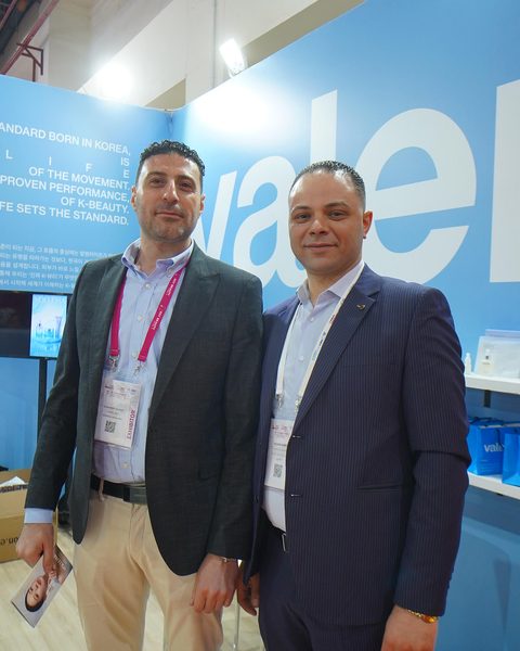 At the booth with a buyer at EGY BEAUTY AFRICA